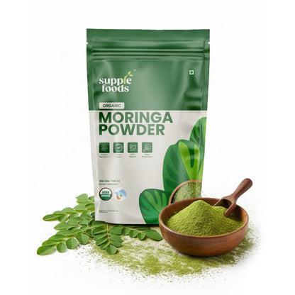 Supple Foods Moringa Powder package with green powder in a wooden bowl on a white background