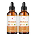 Two bottles of Green People magnesium liquid drops on a white background