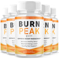 Multiple bottles of Burn Peak dietary supplement with white and orange labels on a white background.